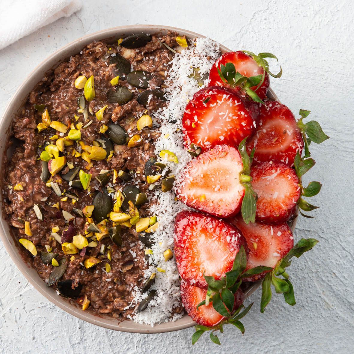 Choc Coconut smoothie bowl with Strawberries and Pistachios.jpg