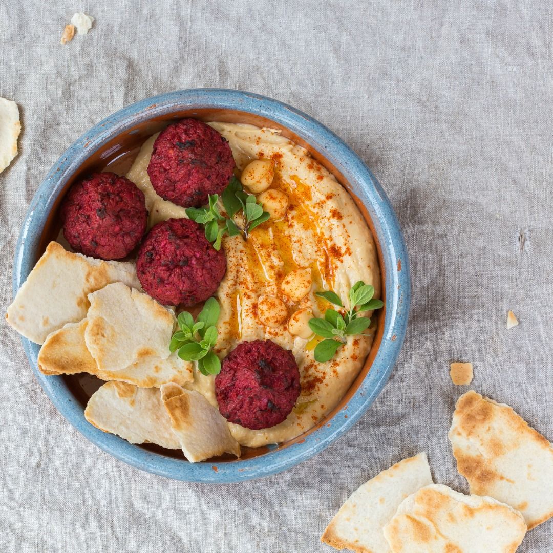 chickpea-hummus-beetroot-falafel-with-paprika-olive-oil-pita-bread-picture-id1321072473.jpg