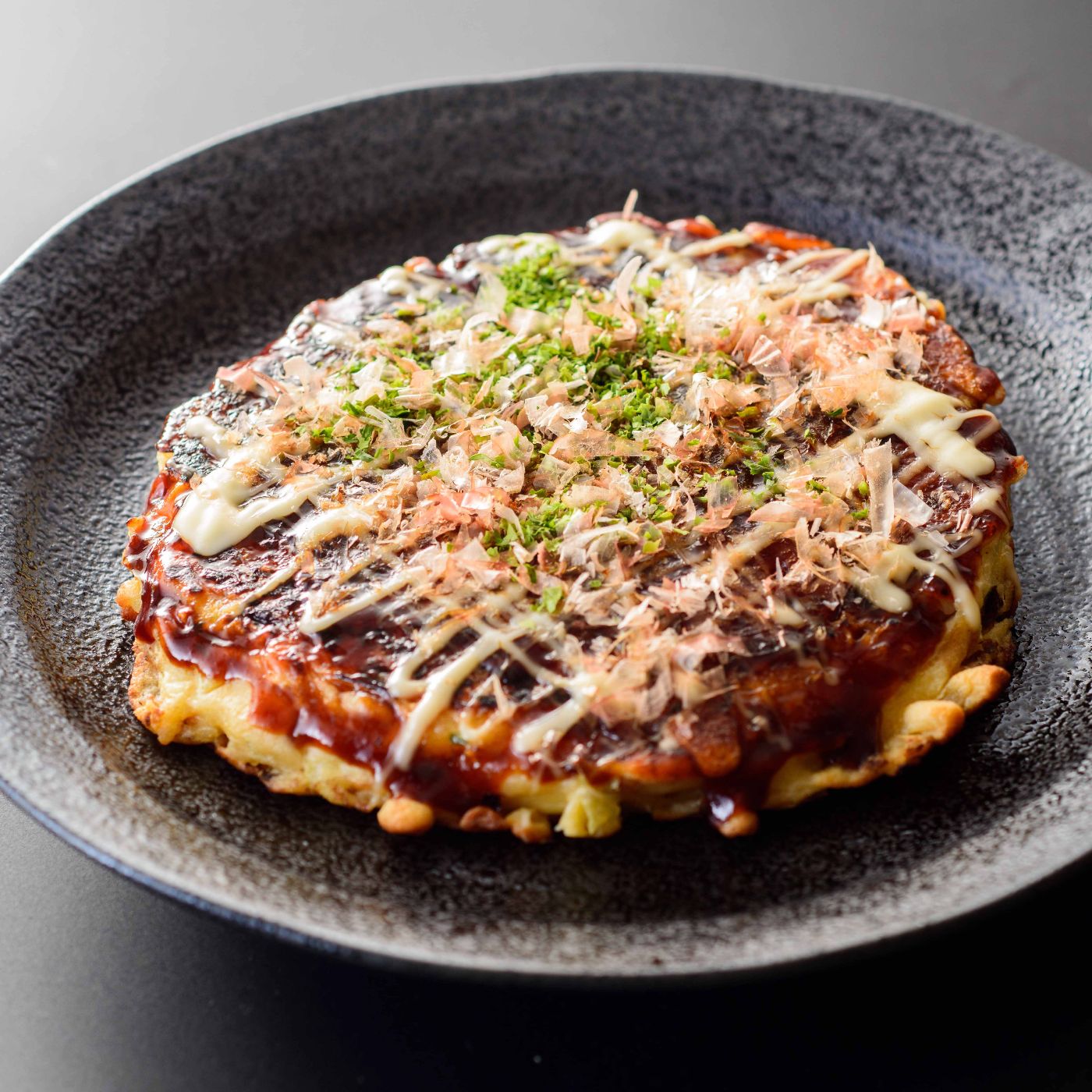 Japanese-food,-Okonomiyaki,-Japanese-style-pancakes-1134067048_7360x4912 square.jpg