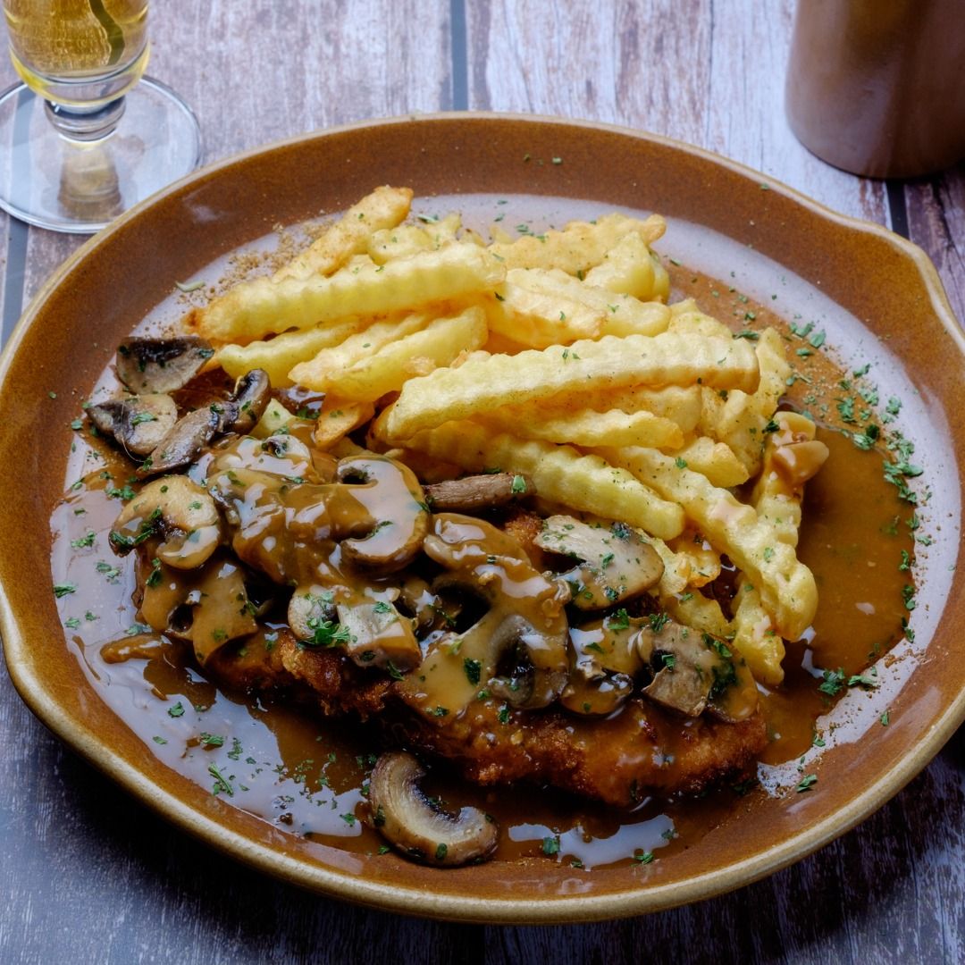mushroom-schnitzel-with-french-fries-picture-id1369086243.jpg