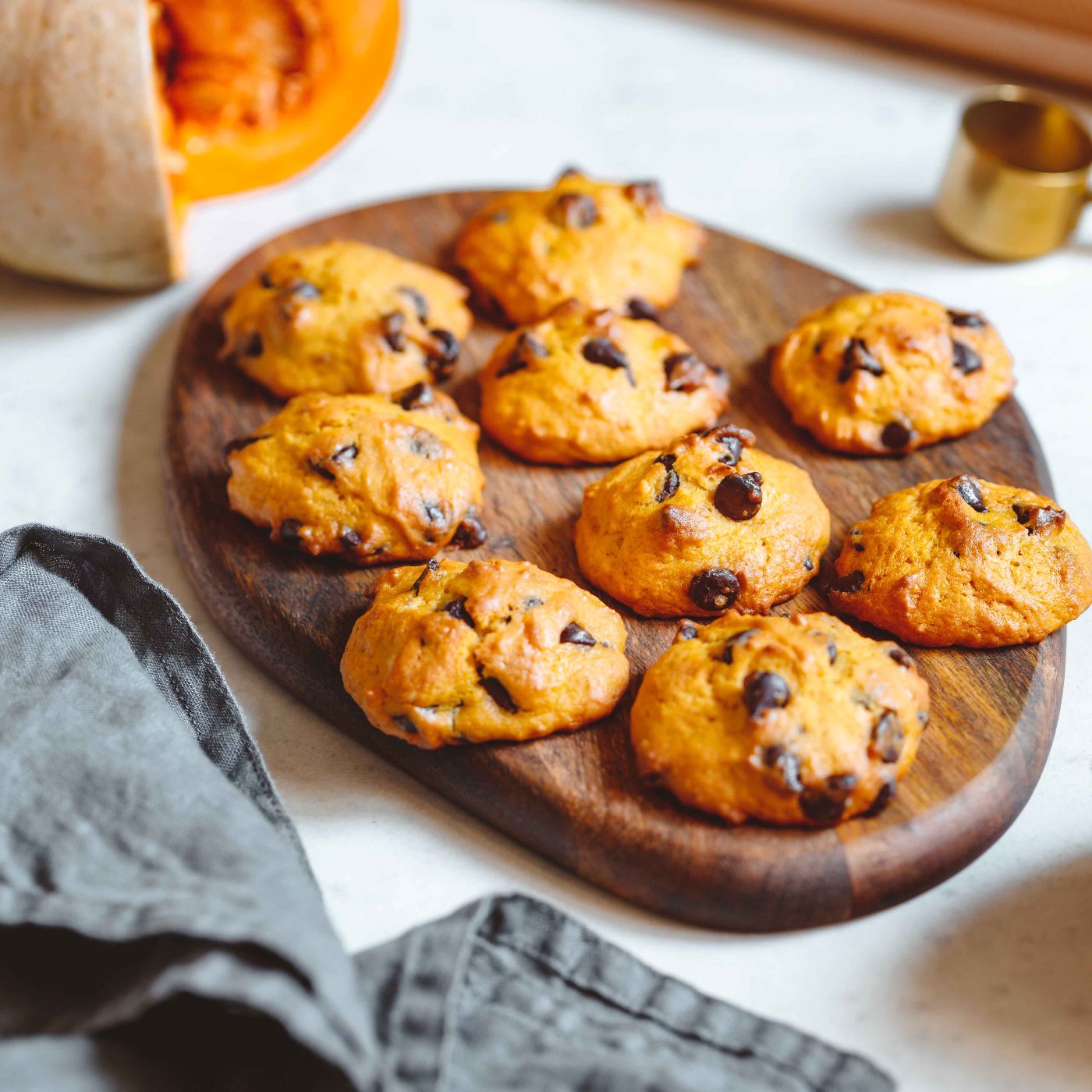 Pumpkin-cookies-with-chocolate-chips-made-from-cake-mix-on-a-wooden-tray.-1161533566_6240x4160 square.jpg