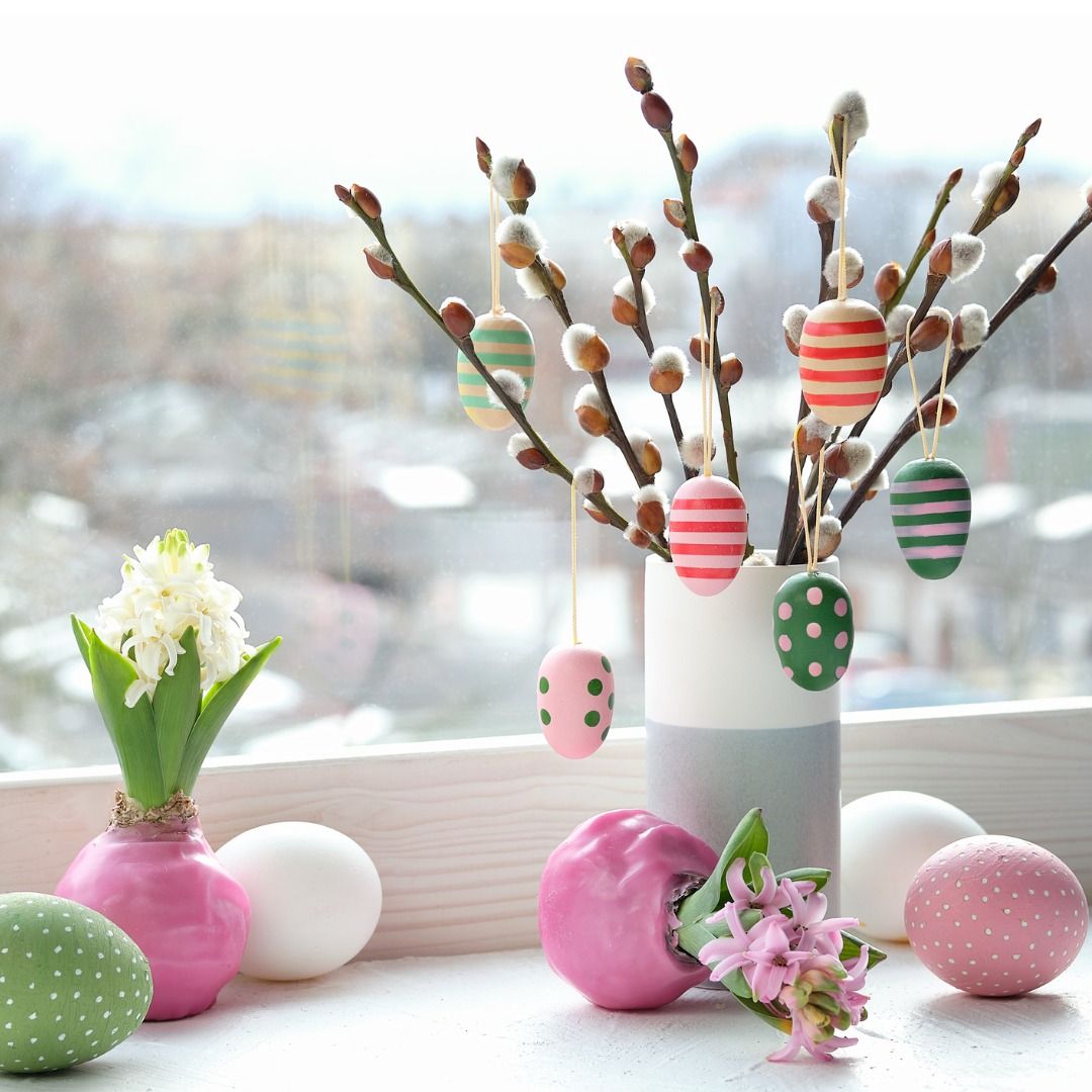 easter-decorations-on-windowsill-in-spring-wooden-painted-eggs-hang-picture-id1308117366.jpg