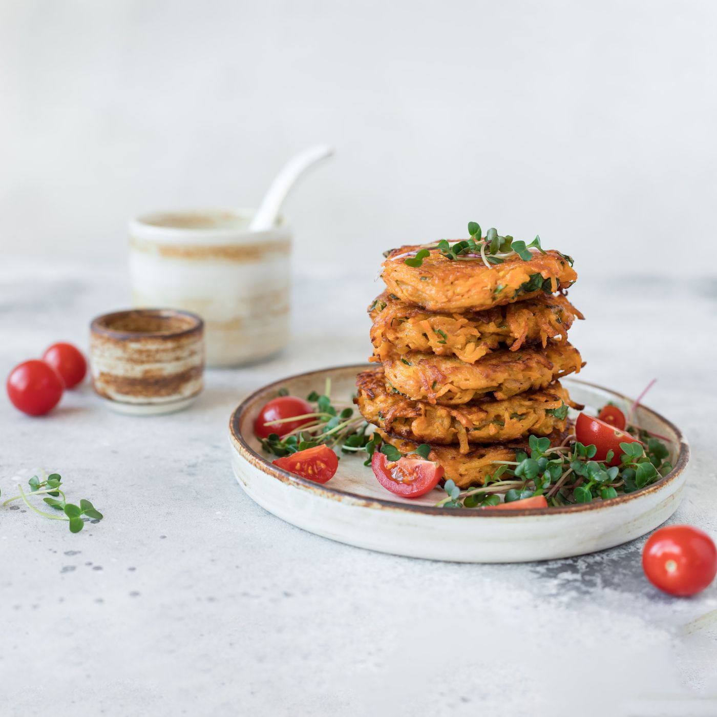 sweet-potato-fritters-served-on-ceramic-plate-1364915438_2125x1416 square.jpeg