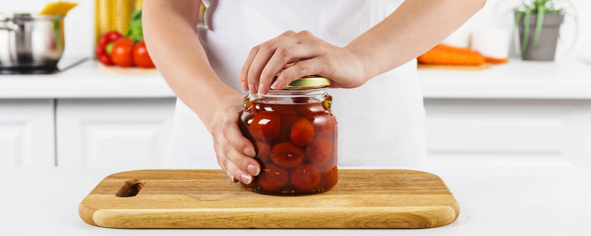 Why does tapping the lid of a hard-to-open jar make it easier to