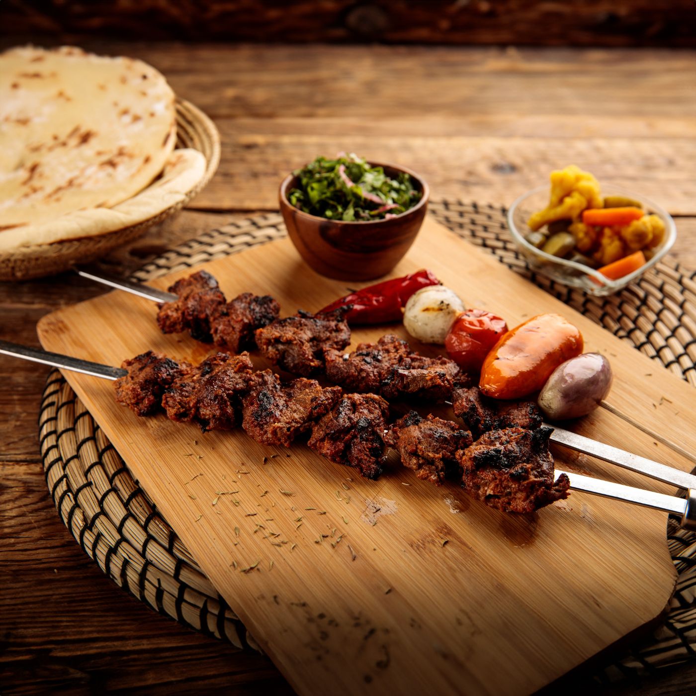 Shish-Kebab-or-beef-seekh-boti-served-in-a-wooden-cutting-board-isolated-on-wooden-background-side-view-1408897423_2125x1416 square.jpeg