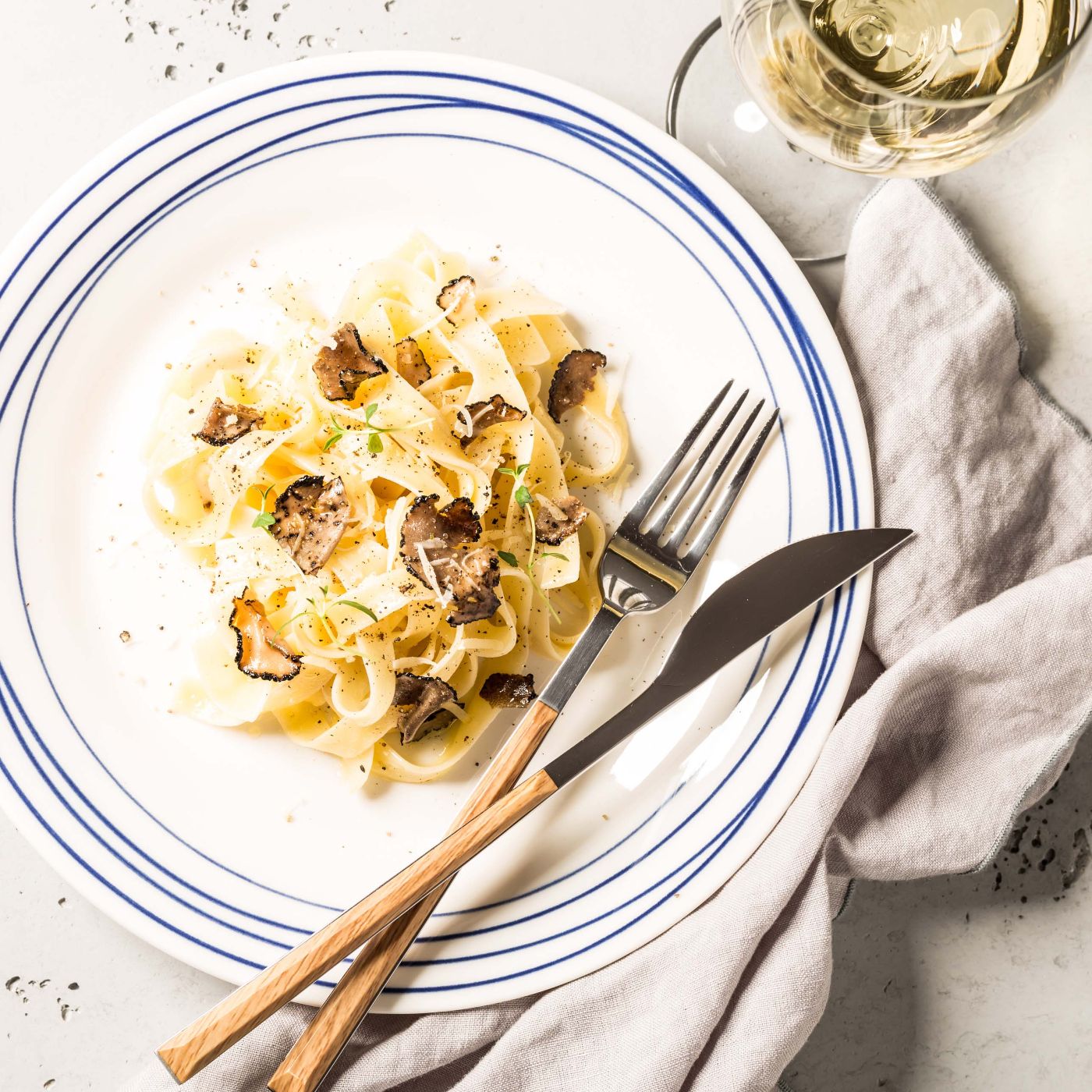 Tagliatelle-pasta-with-black-truffles-and-parmesan-cheese-1132154451_3869x2579 square.jpeg