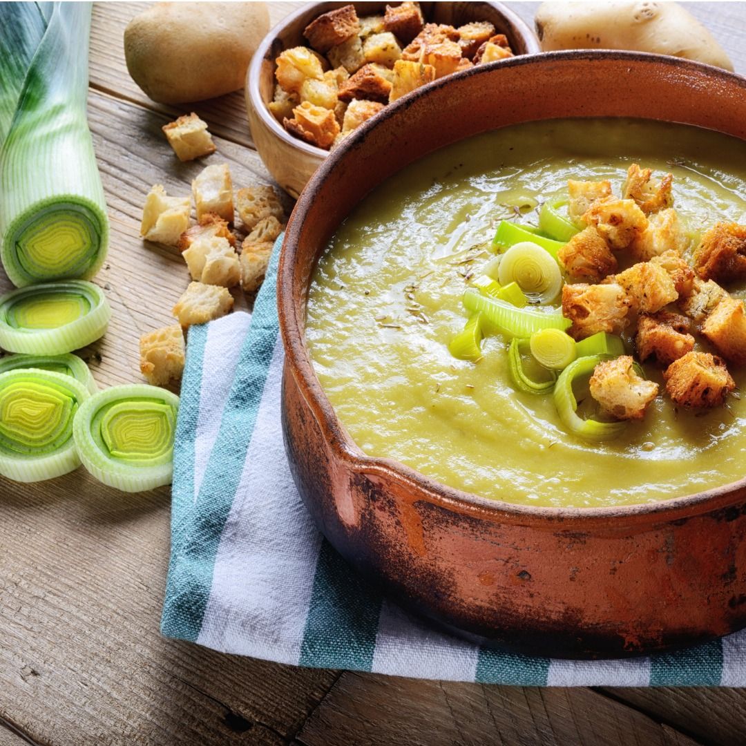 leek-and-potato-soup-with-croutons-on-rustic-wooden-table-closeup-picture-id1330045234.jpg