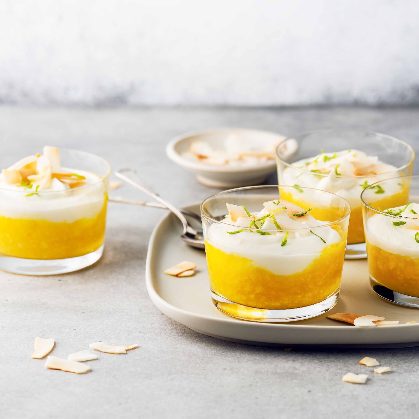 Vegetarian-fruit-cream-dessert-with-coconut-milk-curd-and-mango-puree-in-glass-jars.-1370435551_6436x4597_square.jpg