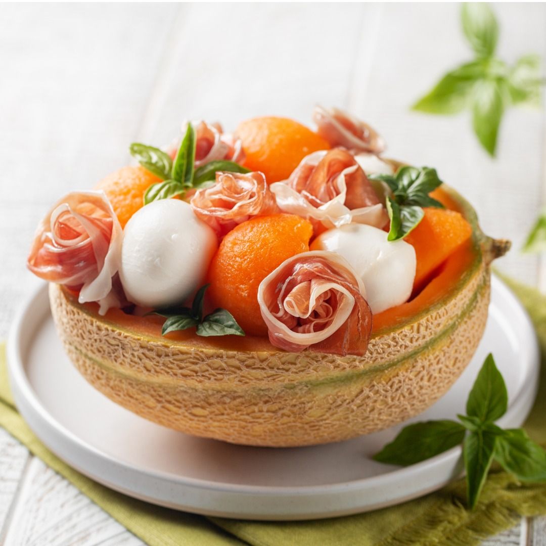 italian-summer-salad-prosciutto-mozzarella-cheese-and-melon-balls-in-picture-id1327338672.jpg