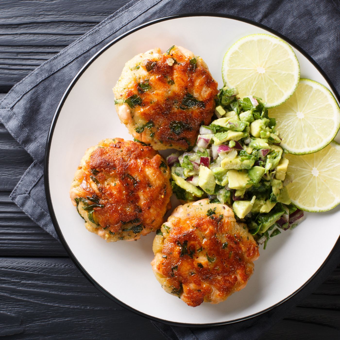 Delicious-healthy-salmon-fritters-with-avocado-salsa-and-lime-closeup-on-a-plate.-horizontal-top-view-1155944749_2125x1416 square.jpeg