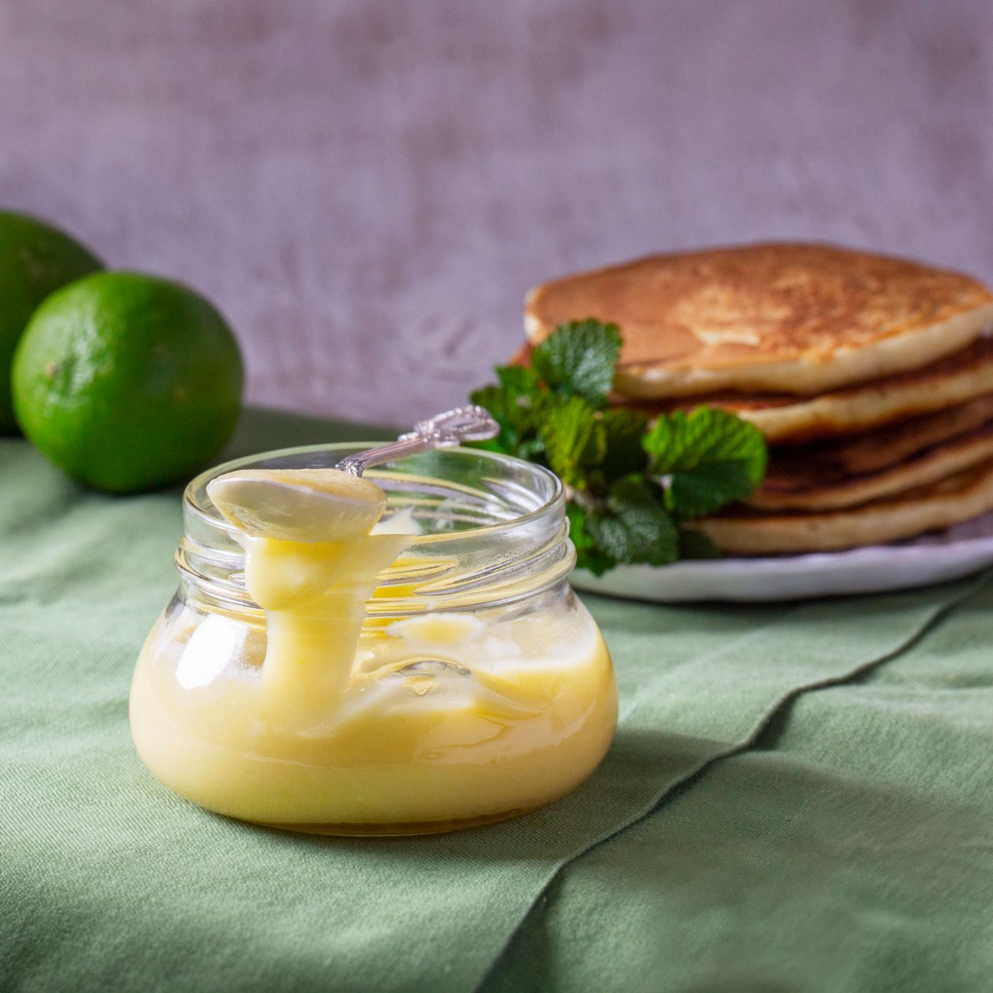 Custard-lime-curd-served-with-pancakes-on-a-light-background.-Rustic-style.-1480185119_2197x1368 square.jpeg