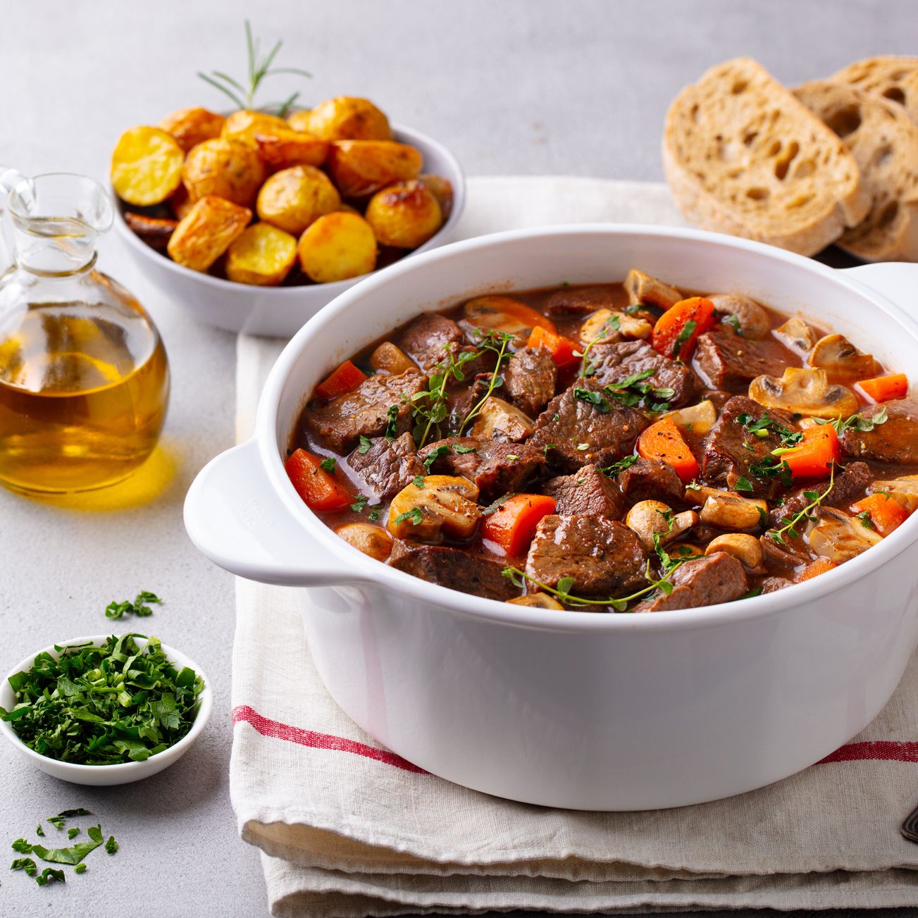 Beef-bourguignon-stew-with-vegetables.-Grey-background.-Copy-space.-1215094848_2306x1305 square.jpeg
