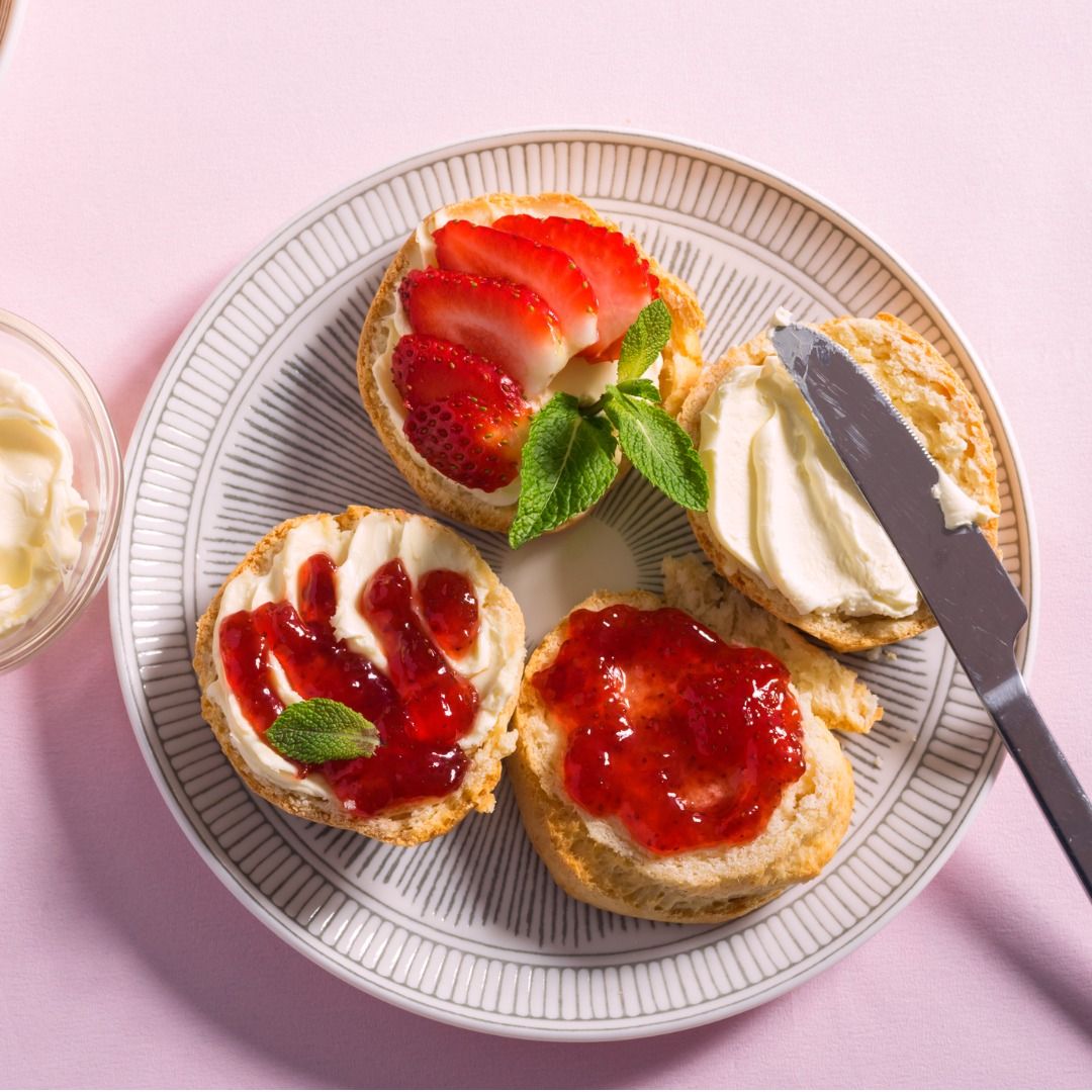 tasty-breakfast-of-scones-with-clotted-cream-and-strawberry-jam-on-pink-background-top-view.jpg_s=1024x1024&w=is&k=20&c=QRoZYruGyePqZScwy3TRjZZJa2bYuA6LP2vVqG2vbdQ=.jpg