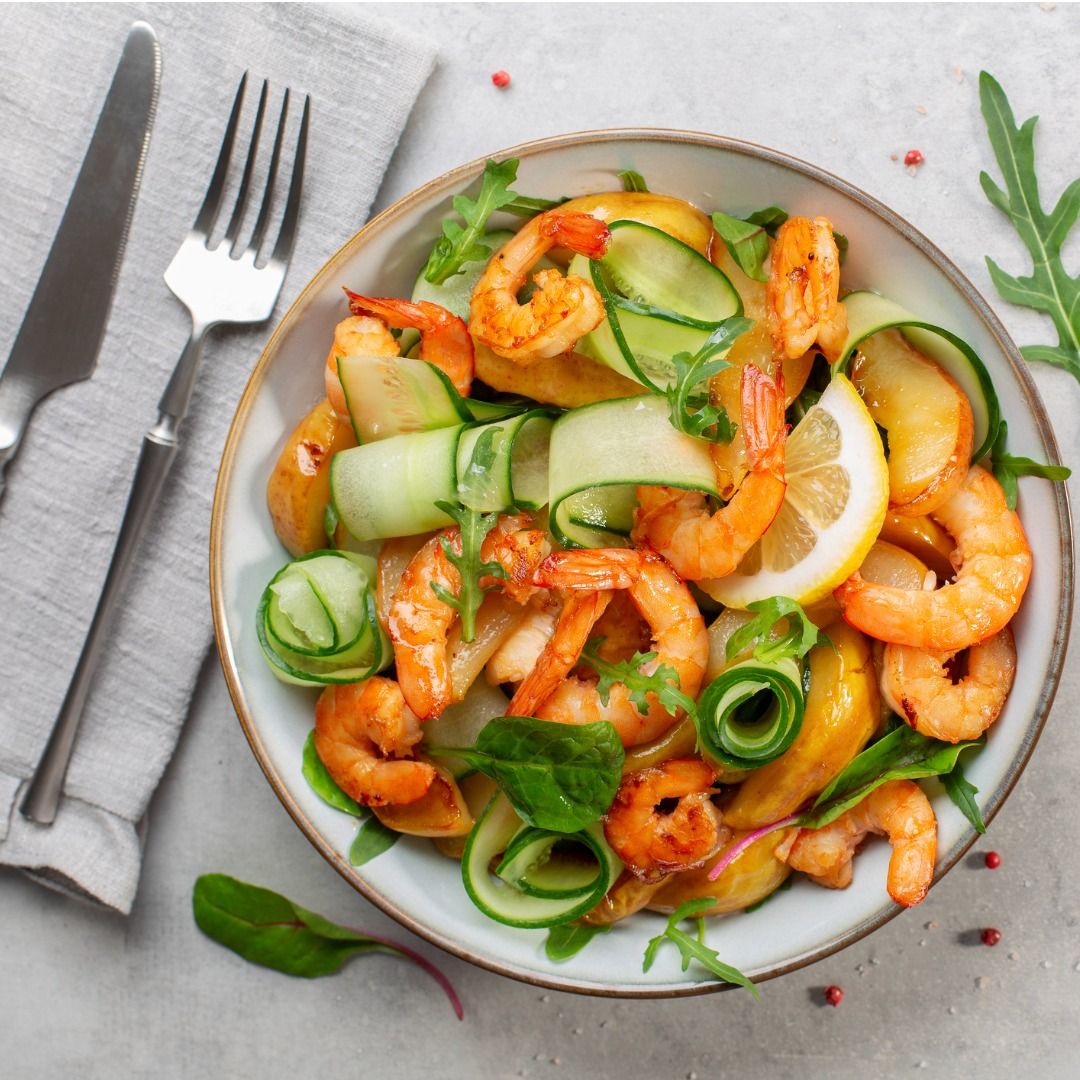 fresh-salad-with-grilled-prawns-caramelized-pears-cucumber-and-mixed-picture-id1329750742.jpg